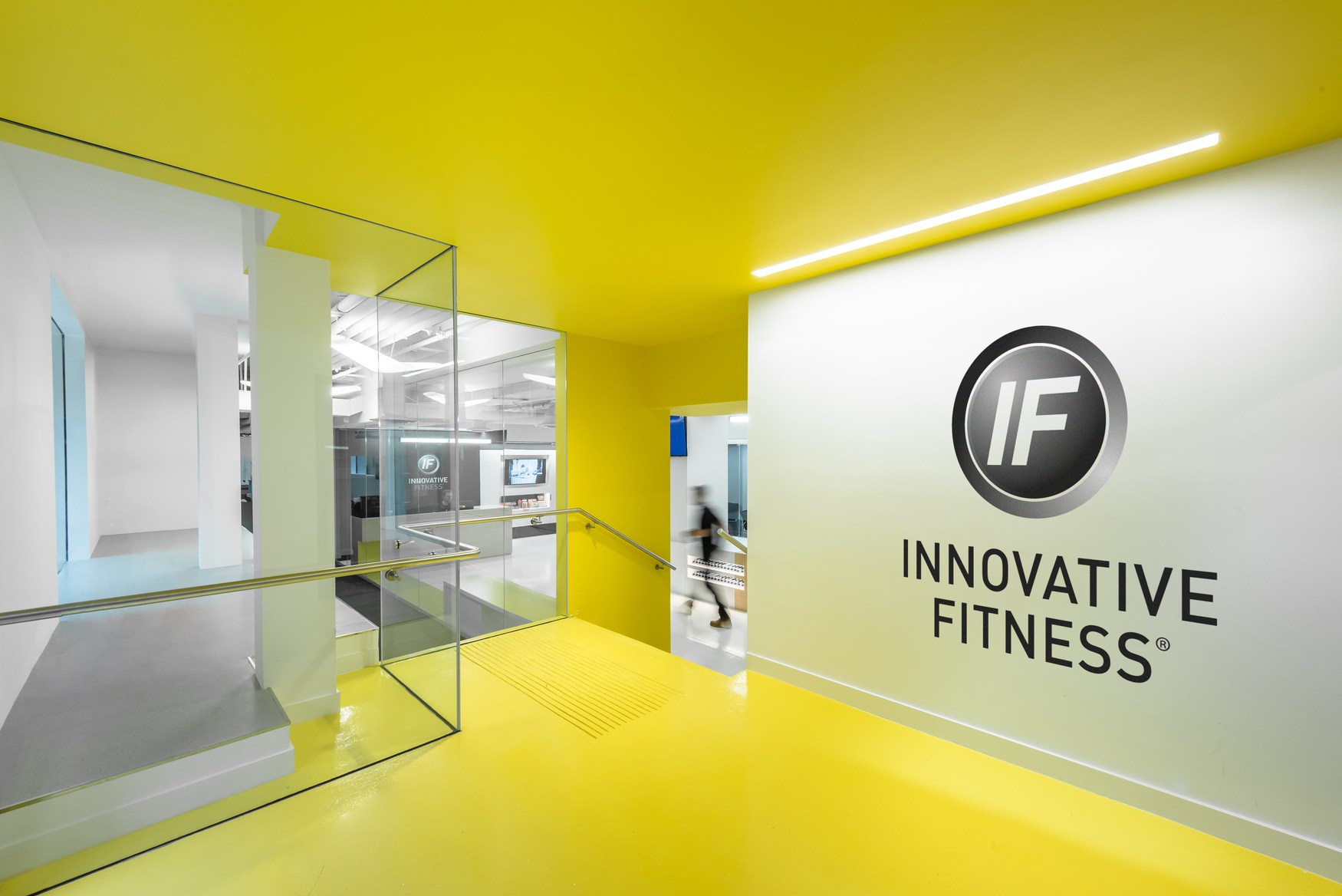 Innovative Fitness Franchise Opportunity - Group of entrepreneurs discussing franchise options in a modern office setting.