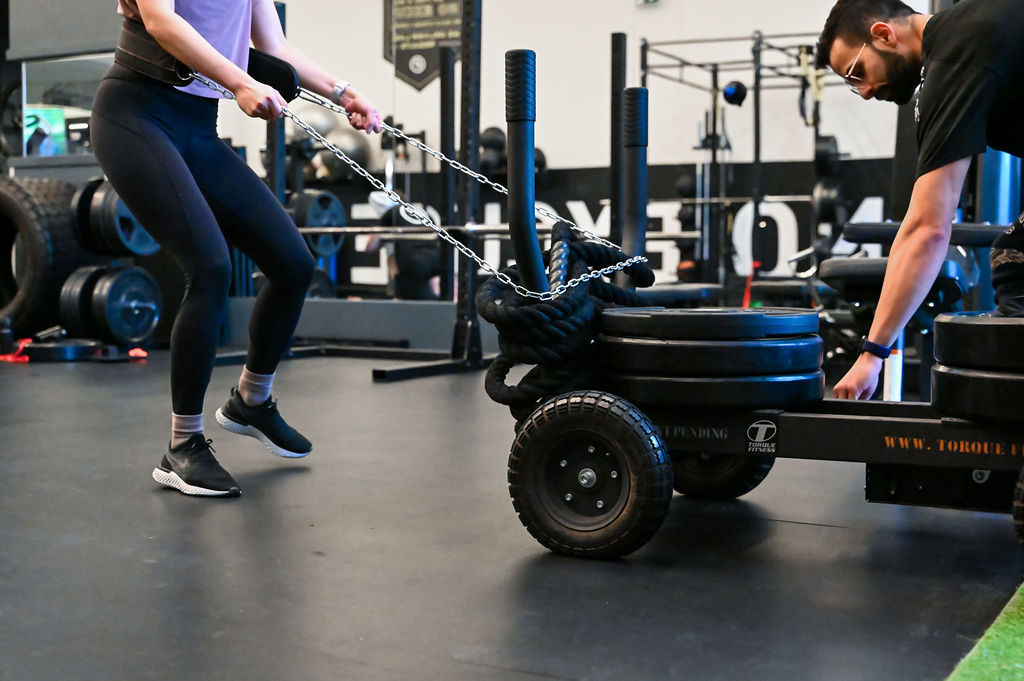 women pushing weights